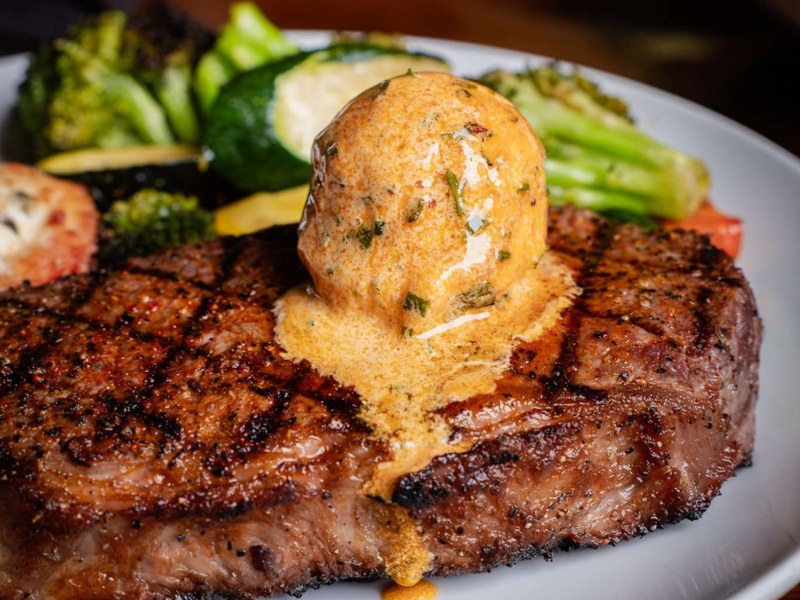 Delmonico ribeye topped with compound butter