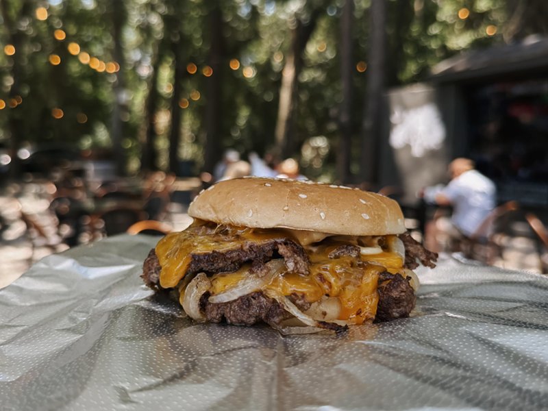 Burger served outdoors at Tin & Tallow