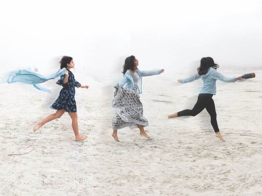 Fashion Shoot on the beach with girl wearing multiple outfits and dancing