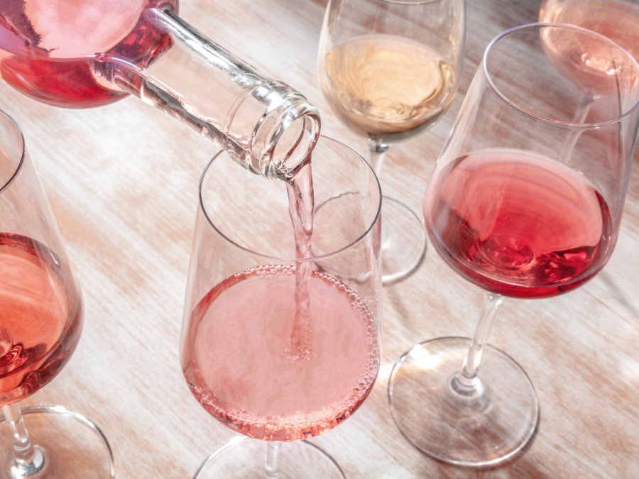 Rose Wine being poured into wine glasses