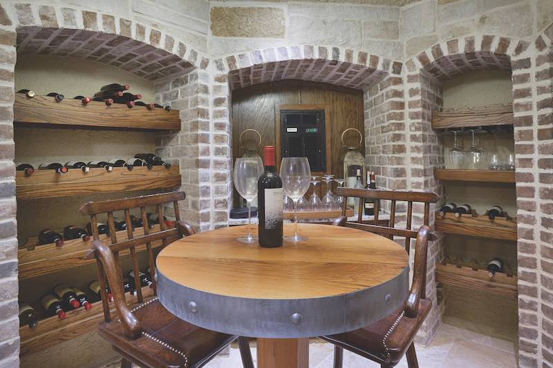 Wine Cellar with wine and two wine glasses on the table
