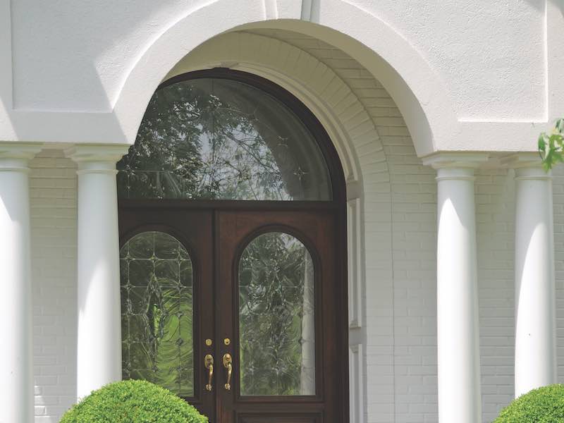 Leaded Glass Entry Door on a White Stucco Residence