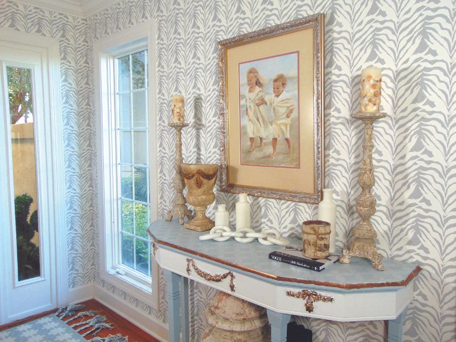 A grand entry way with wallpaper