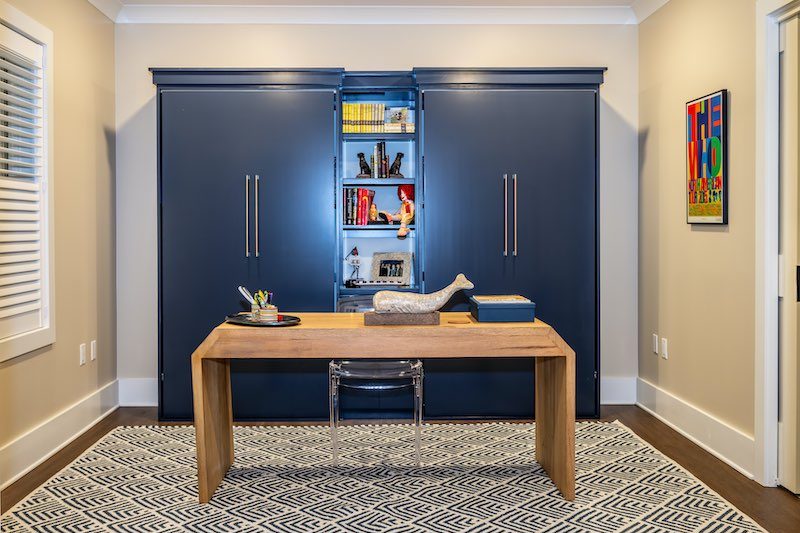 Room staged as an office that can easily be turned into a guest room