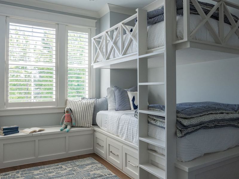 Built in bunk beds and bench along windows