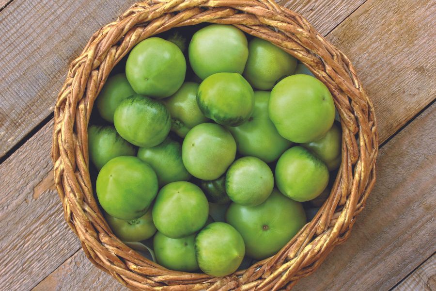 Green Tomatoes in a wicker basket