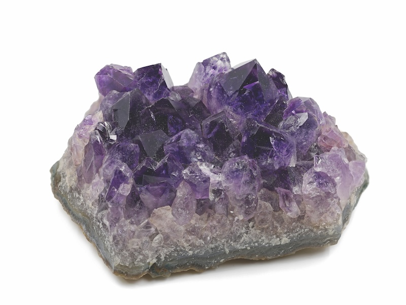 violet amethyst crystal isolated on white background