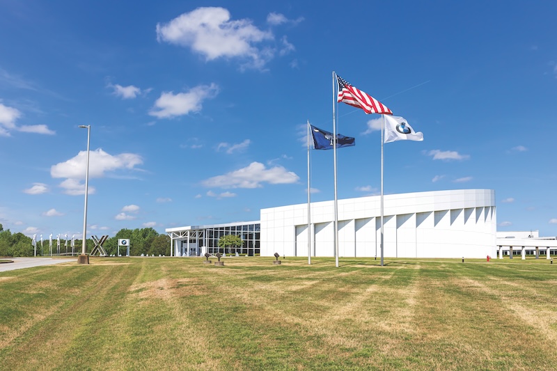GREER, SC, USA 24 APRIL 2022: BMW Zentrum Visitors Center, showing building, flags, campus, and BMW signs.