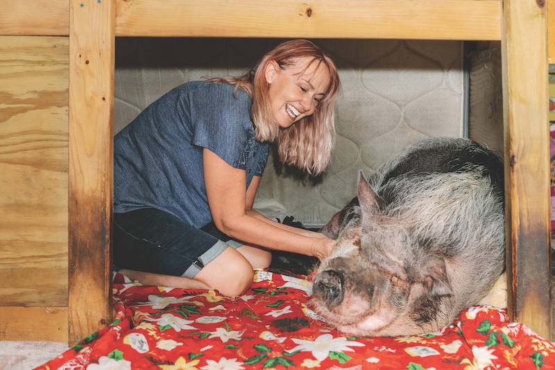 Victoria Rapolti with her pet pig in her pen