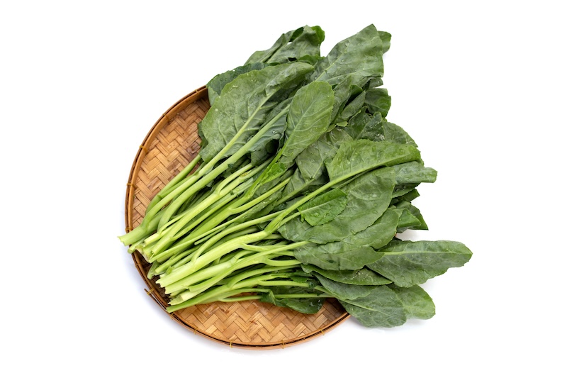 Collard greens on white background.