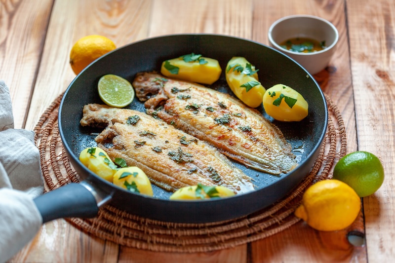 Sole flatfish cooked on a pan, portion for two