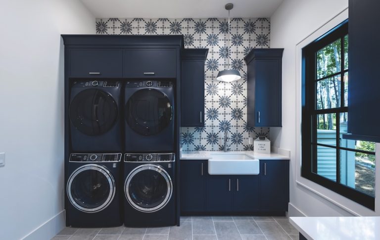 Laundry Room with Navy Blue cabinets and double washer and dryer