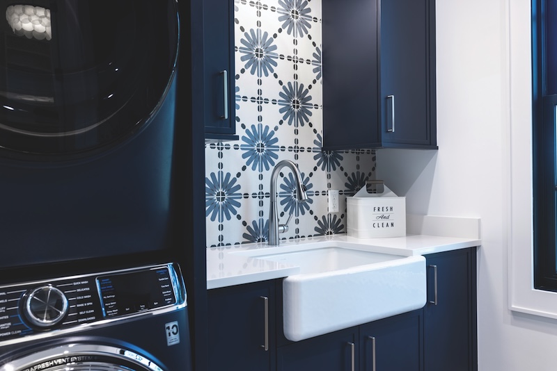 Laundry room with navy blue and white accents
