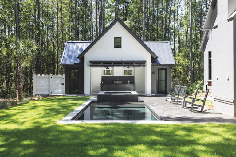 Exterior of home with backyard living - pool and cabana