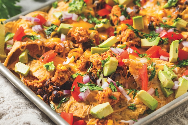 Homemade Vegan Loaded Sheet Pan Nachos with Tomato Cilantro and Lime