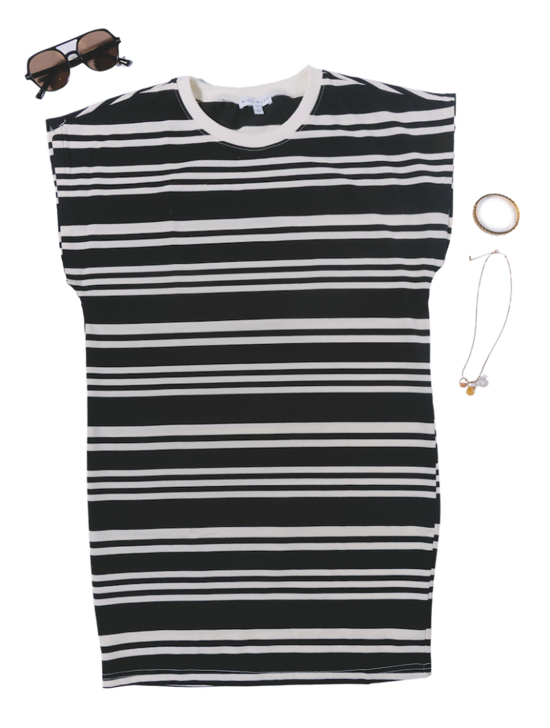 This black-and-white striped T-shirt dress from The Haven Boutique blends casual with a sporty edge,