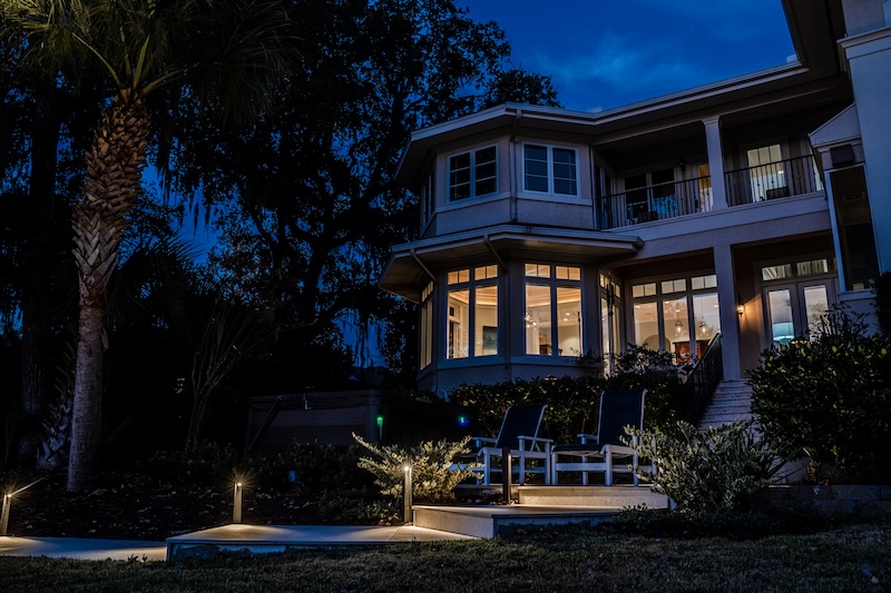 Exterior of home at night with cozy mood lighting