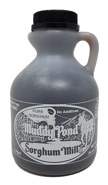 Modern plastic bottle of sorghum syrup with a sleek design and clear labeling.