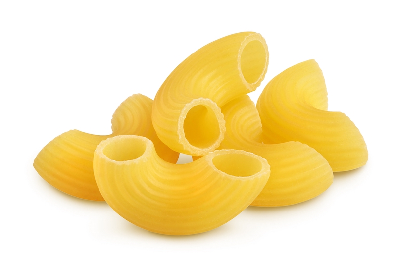 Uncooked elbow macaroni pasta, dry and golden