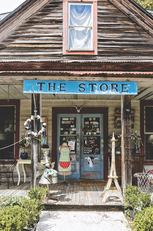 The Store in Bluffton exterior with antique decor, wreaths, apron and knick-knacks.