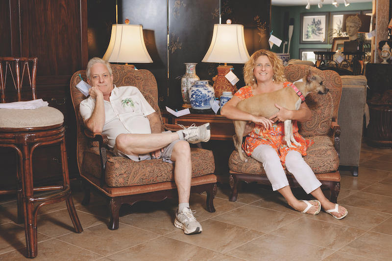 Marda Gunning and Michael Shanley pose in their co-owned store, Michael and Co. antiques