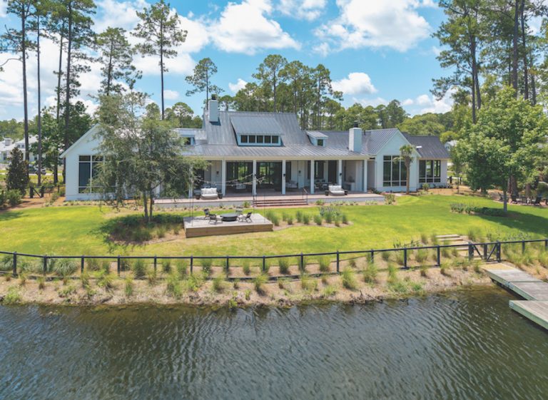 Palmetto Bluff backyard with a fire pit next to the water