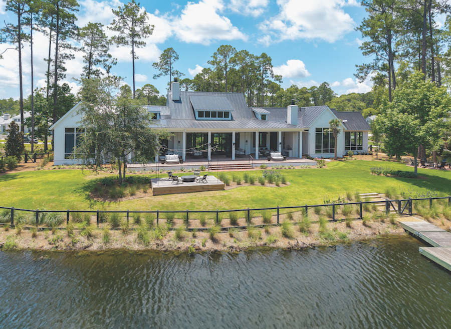 Palmetto Bluff backyard with a fire pit next to the water