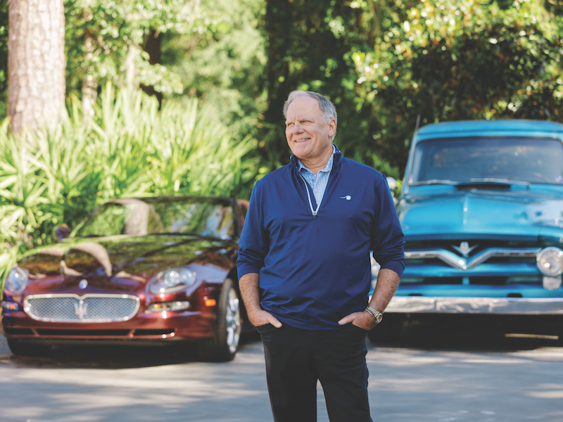 Rick Sabol Car Enthusiast Hilton Head Island in front of two classic cars.