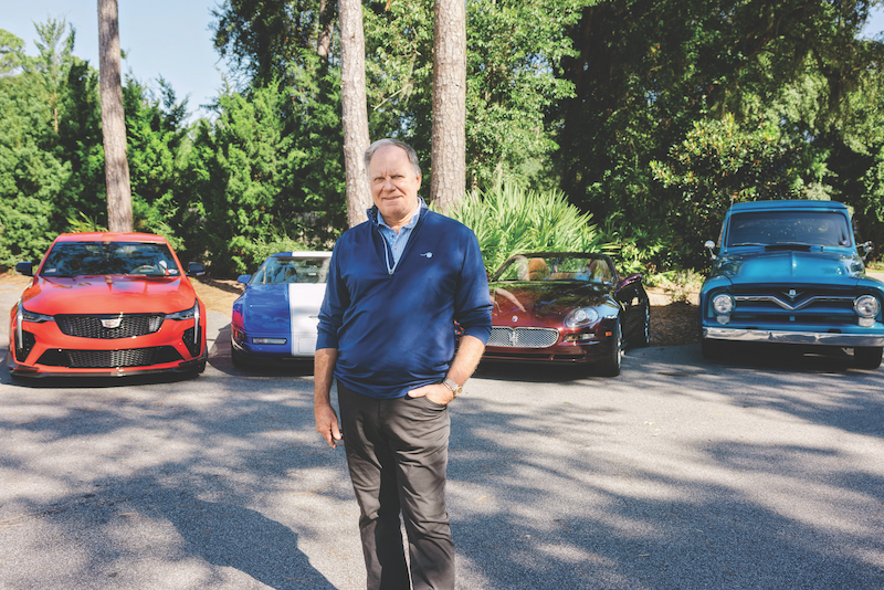 Rick Sabol, new executive director of the Hilton Head Island Concours d'Elegance, poses in front of his classic cars