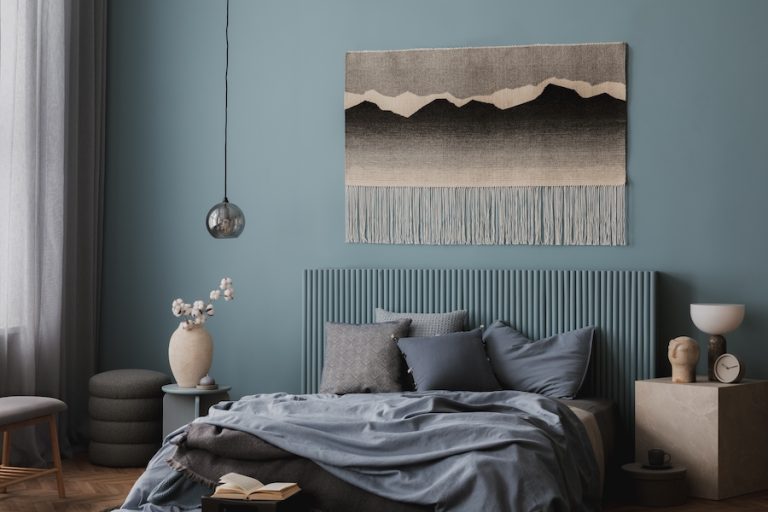 Bedroom with blue walls and blue decor monochrome design