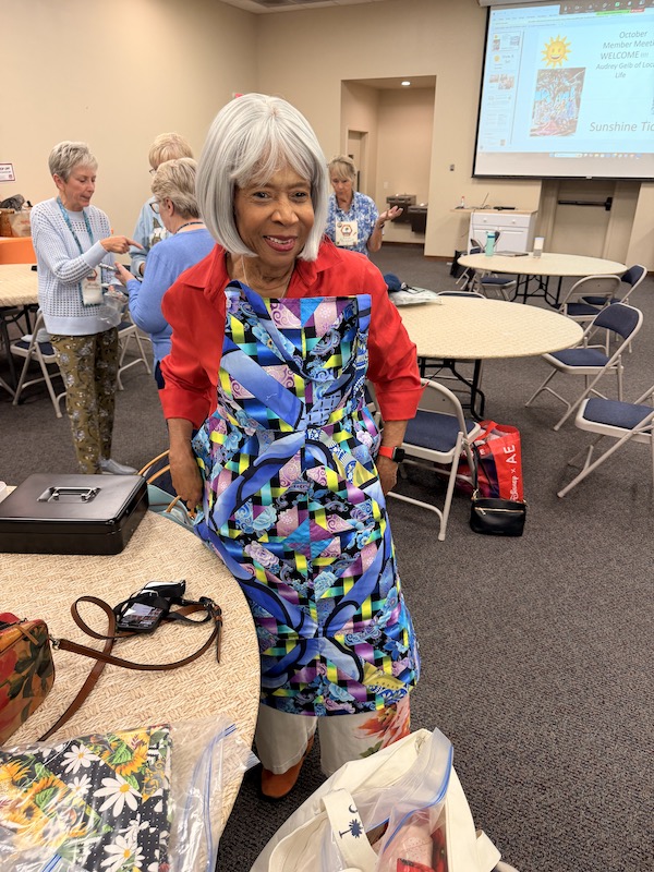 Claudia Buckingham with her apron Palmetto Quilt Guild