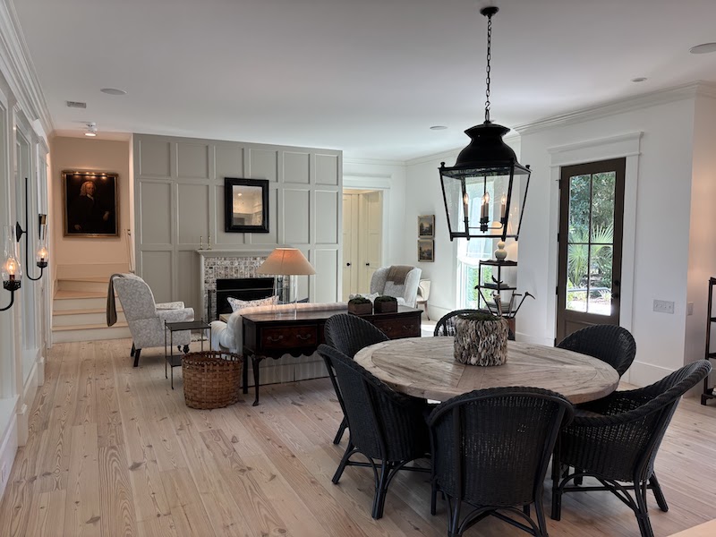 Dining table seating area black wicker chairs accents neutral minimalist