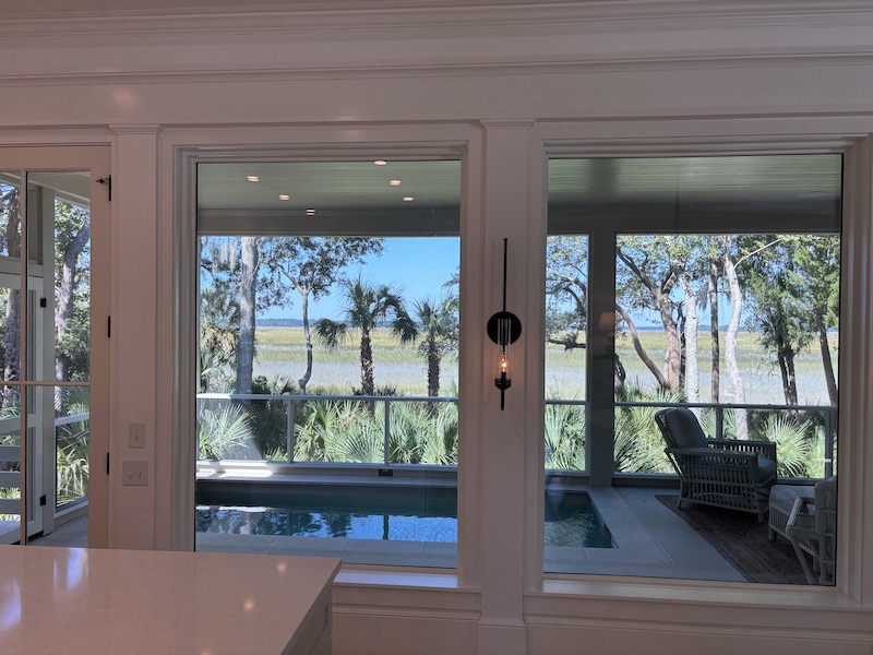 Interior of home white walls looking out on Lowcountry marshland