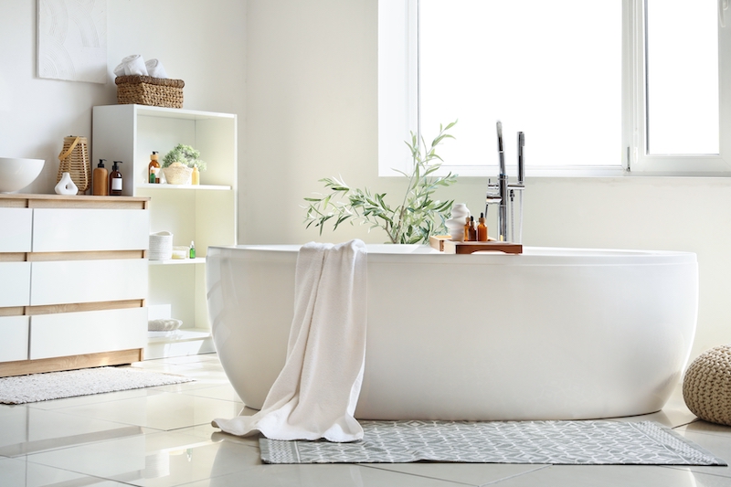 Serene minimalist bath with plants and windows