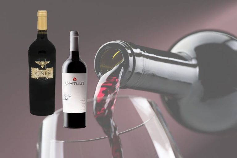 Wine being poured with two wine bottles displayed