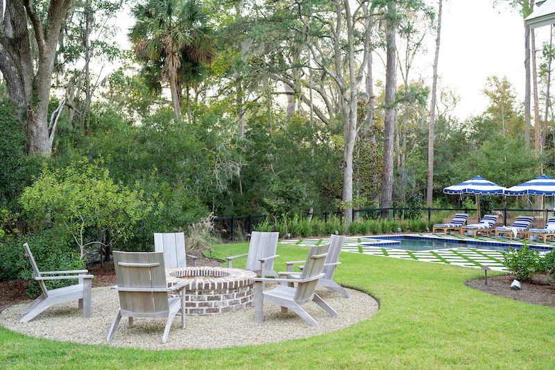 Fire pit in Palmetto Bluff home backyard by Pearce Scott Architects and Year Round Pool