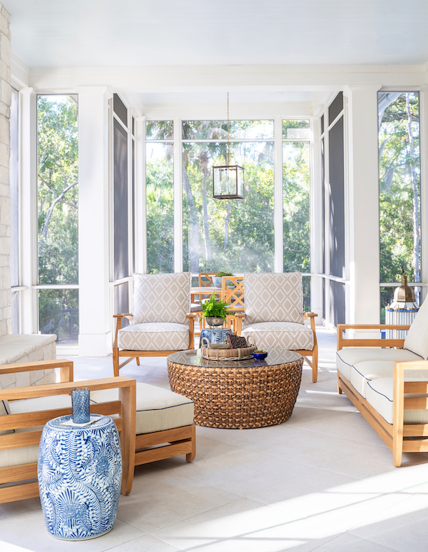 Glass porch in Palmetto Bluff home backyard by Pearce Scott Architects