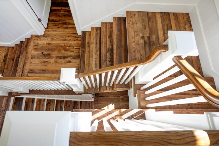 Overhead of three-story staircase in Palmetto Bluff home by Pearce Scott Architects