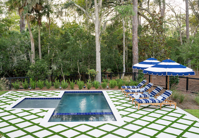 Paver pool and deck in Palmetto Bluff home backyard by Pearce Scott Architects and Year Round Pool