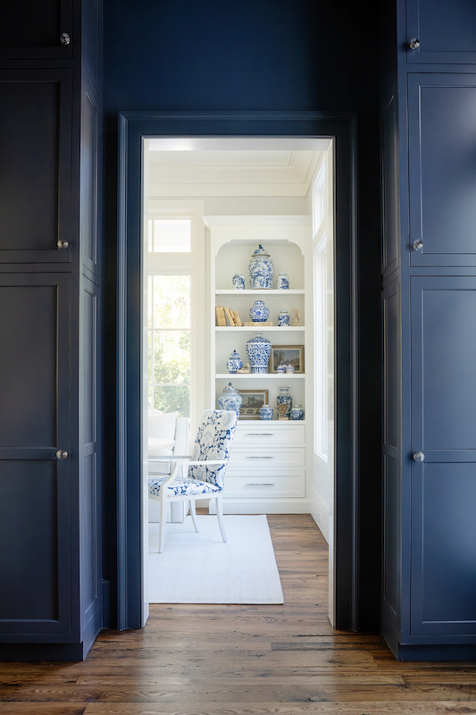 View of dining room from galley kitchen by Pearce Scott Architects in Palmetto Bluff