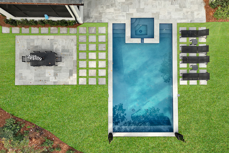 Overhead of Long Cove home Versailles French pattern tiles pool deck by Year Round Pool Hilton Head Island