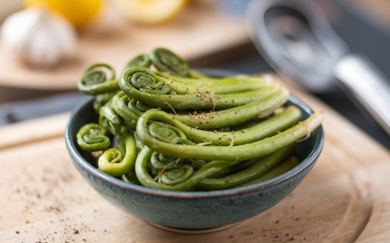 Fiddleheads: The young, coiled fronds of ferns, often foraged in the spring, and cooked in a variety of dishes for their earthy flavor.