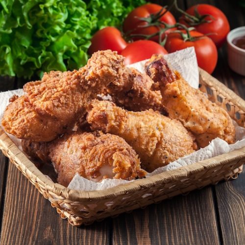 Breaded crispy fried kentucky chicken drumctick in the basket
