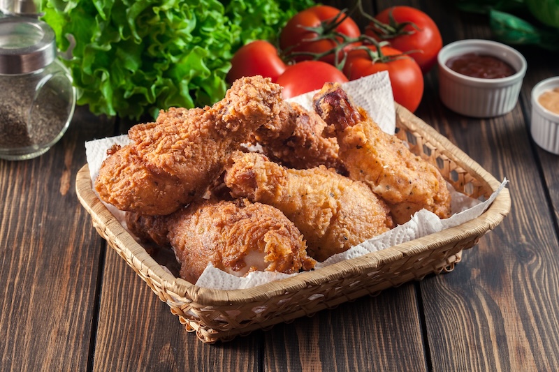 Breaded crispy fried kentucky chicken drumctick in the basket