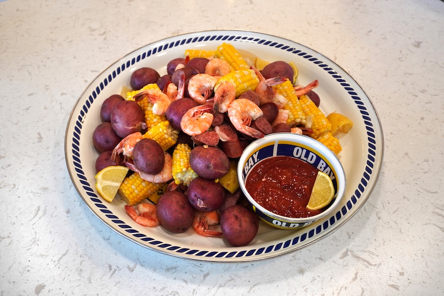 Lowcountry boil with shrimp sausage corn and potatoes served on platter