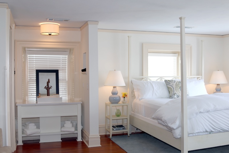 Elegant guest room at Anchorage 1770 with tall ceilings and historic details