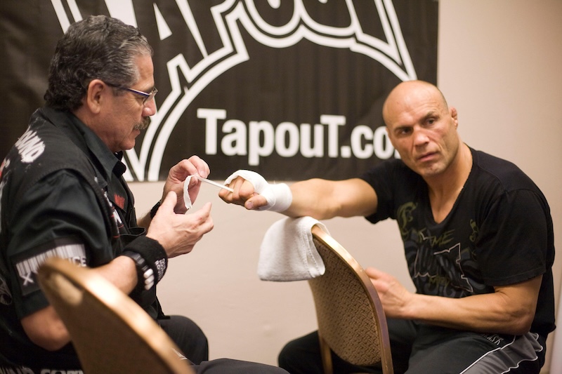 Couture gets his hands wrapped by legendary cutman Jacob “Stitch” Duran