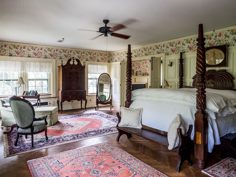 Historic guest room at Greyfield Inn with classic Southern decor and four-poster bed