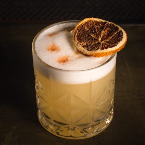Whiskey Sour drink in a bar environment