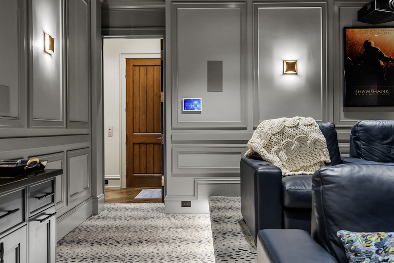 Acoustic treatments and concealed speakers for Luxury home theater by Fusion Audio and Video
